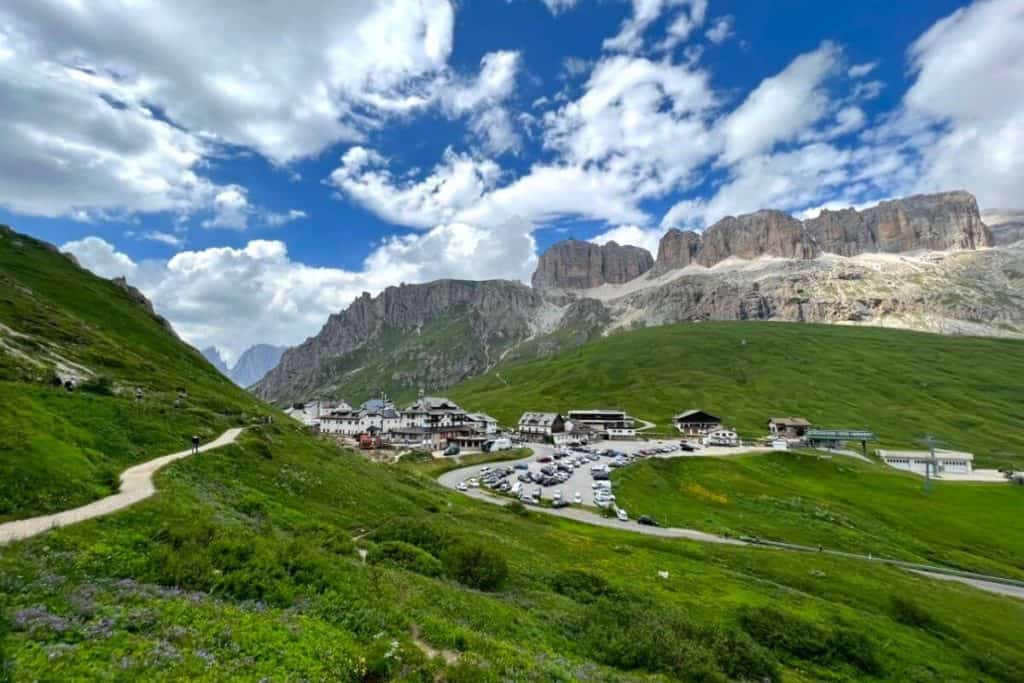 Scenic mountain village nestled in the Dolomites with stunning views and vibrant green landscapes.